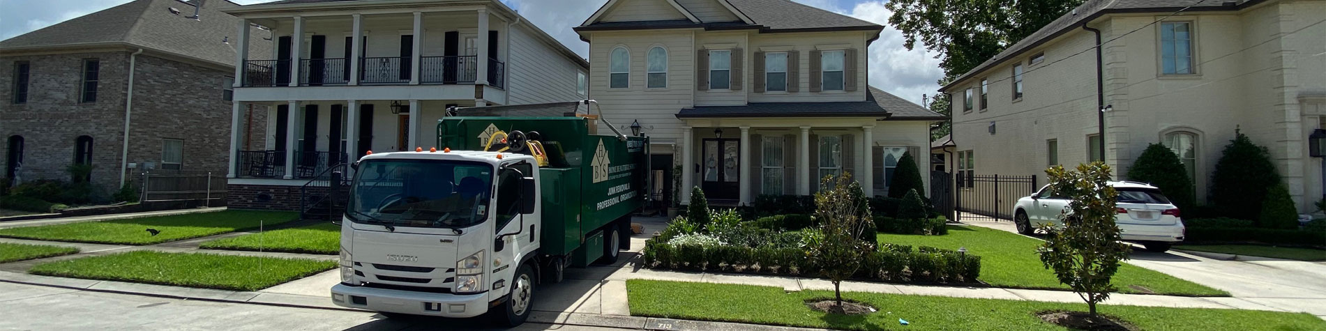 Junk Removal Truck in a Madisonville Neighborhood Completing Junk Removal Work